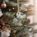 a christmas ornament hanging from a christmas tree