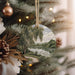 a christmas ornament hanging from a christmas tree