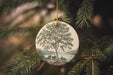 a christmas ornament hanging from a christmas tree