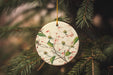 a ceramic ornament hanging from a christmas tree