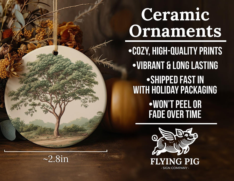 a ceramic ornament with a picture of a tree on it