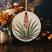 a plate with a plant on it sitting on a table