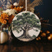 a ceramic ornament with a tree on it