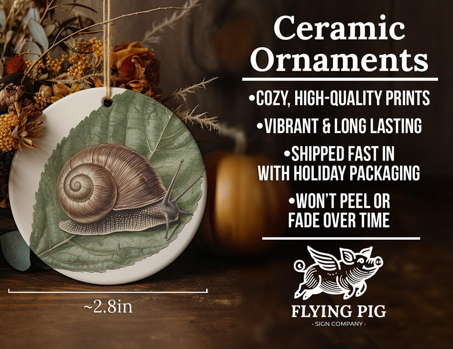 a ceramic ornament with a snail painted on it