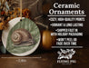 a ceramic ornament with a snail painted on it