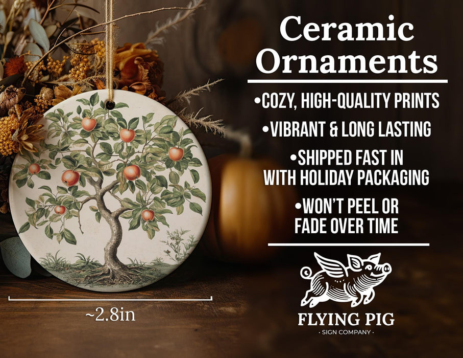 a ceramic ornament with an apple tree on it
