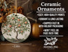 a ceramic ornament with an apple tree on it