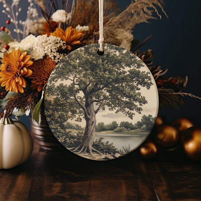 a ceramic ornament with a tree on it