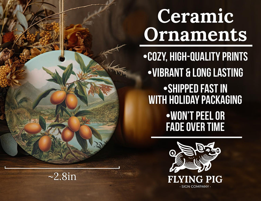 a ceramic ornament with a painting of oranges on it