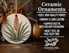 a ceramic ornament with a plant on it