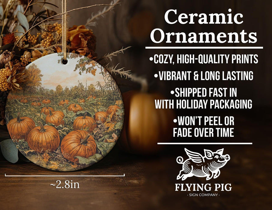 a ceramic ornament with a painting of pumpkins on it