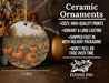a ceramic ornament with a painting of pumpkins on it