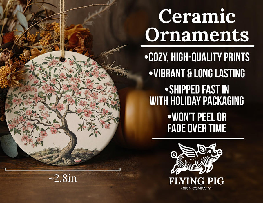 a ceramic ornament with a tree on it