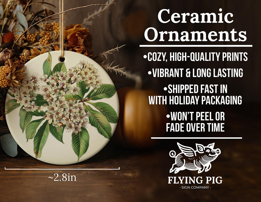 a ceramic ornament with flowers and leaves on it