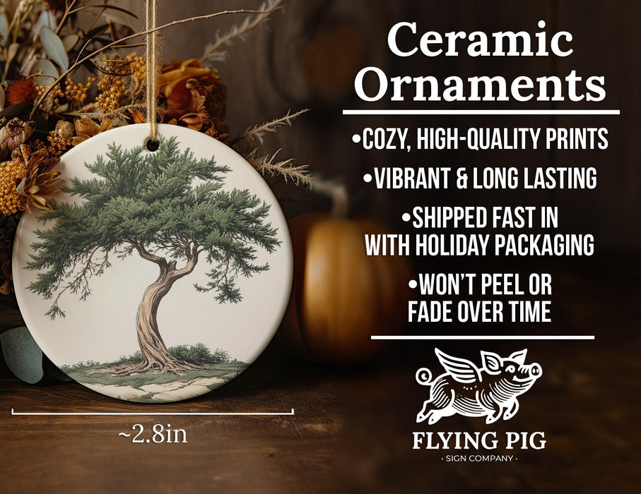 a ceramic ornament with a tree on it