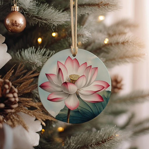 a ceramic ornament hanging from a christmas tree