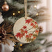 a christmas ornament hanging from a christmas tree