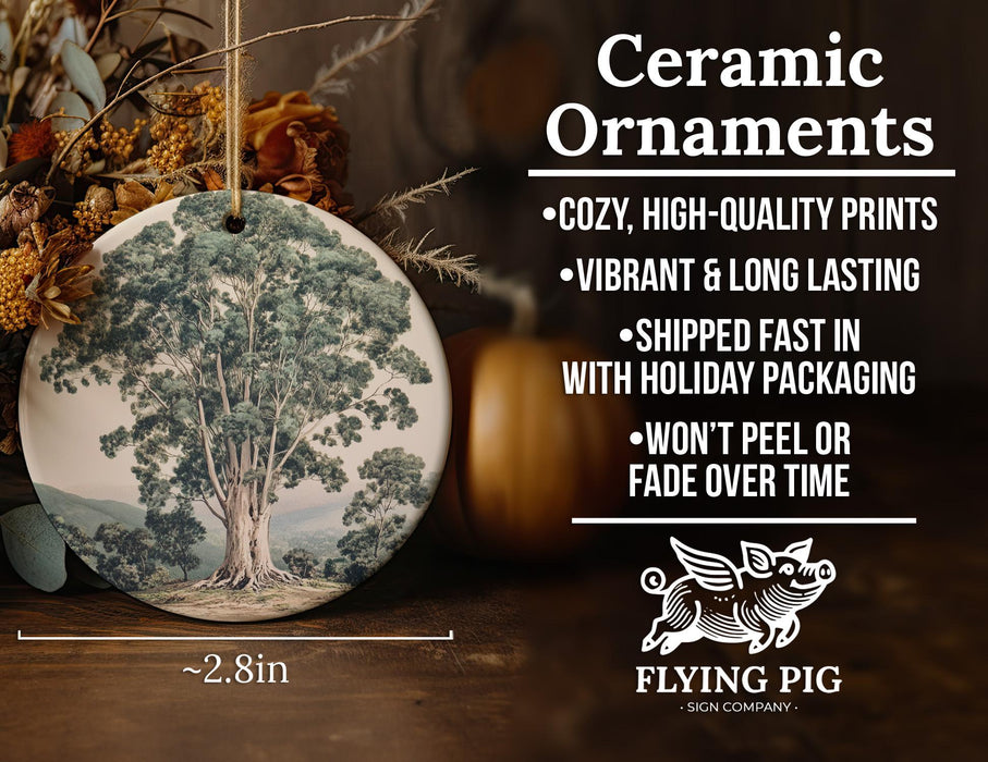 a ceramic ornament with a tree on it