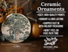 a ceramic ornament with a tree on it