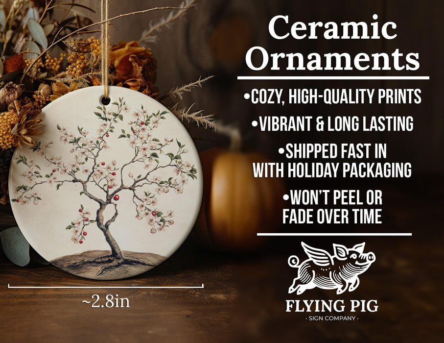 a ceramic ornament with a tree on it