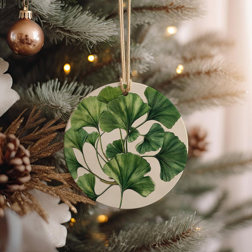 a ceramic ornament hanging from a christmas tree