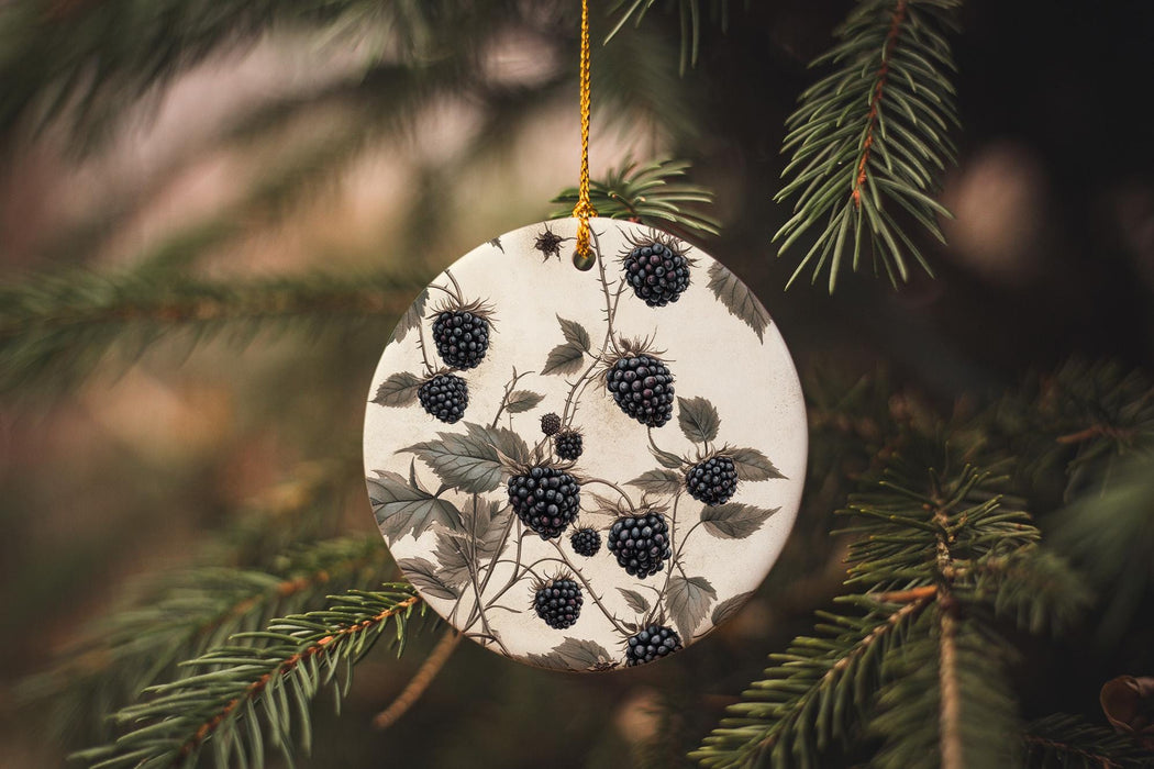 a ceramic ornament hanging from a pine tree