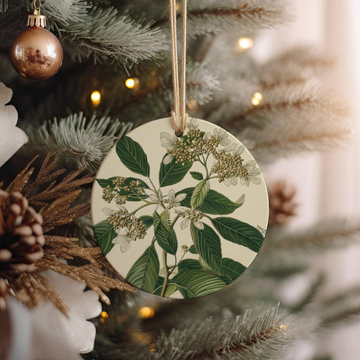 a ceramic ornament hanging from a christmas tree
