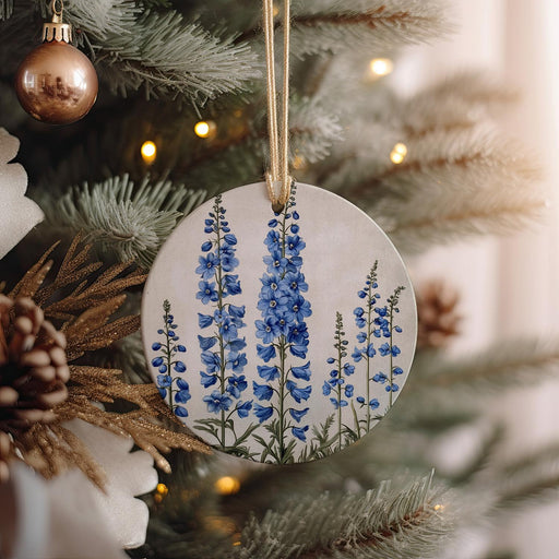 a ceramic ornament hanging from a christmas tree