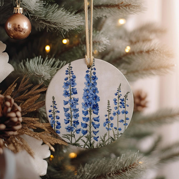 a ceramic ornament hanging from a christmas tree