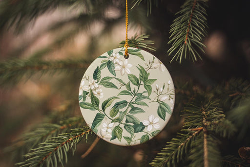 a ceramic ornament hanging from a christmas tree