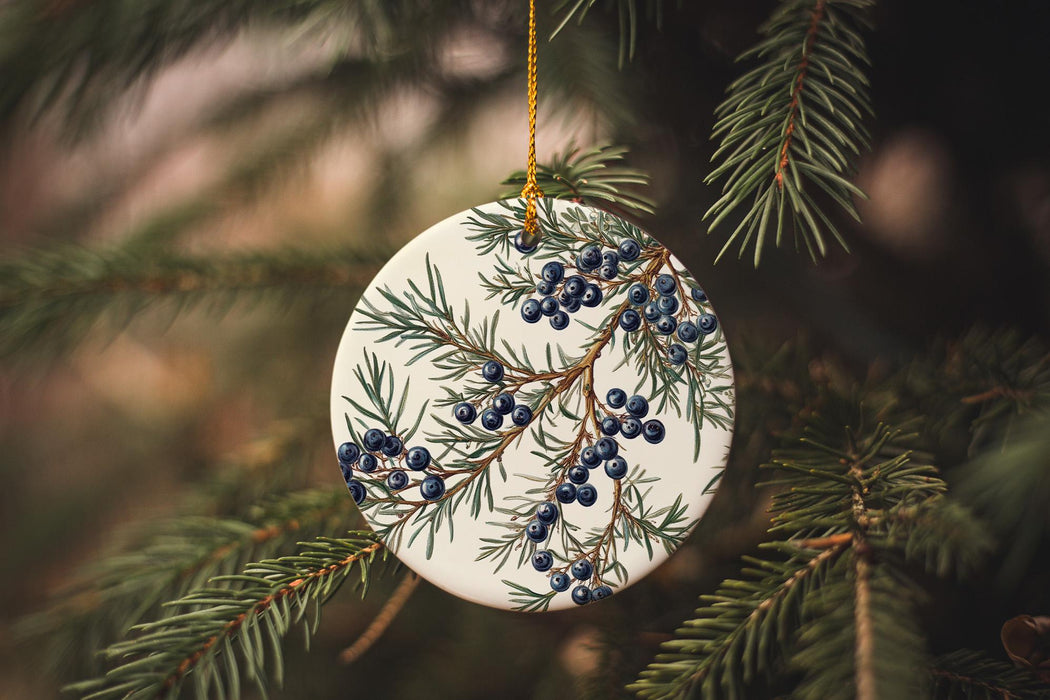 a ceramic ornament hanging from a christmas tree