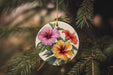 a ceramic ornament hanging from a christmas tree