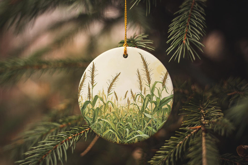 a ceramic ornament hanging from a pine tree