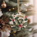 a christmas ornament hanging from a christmas tree