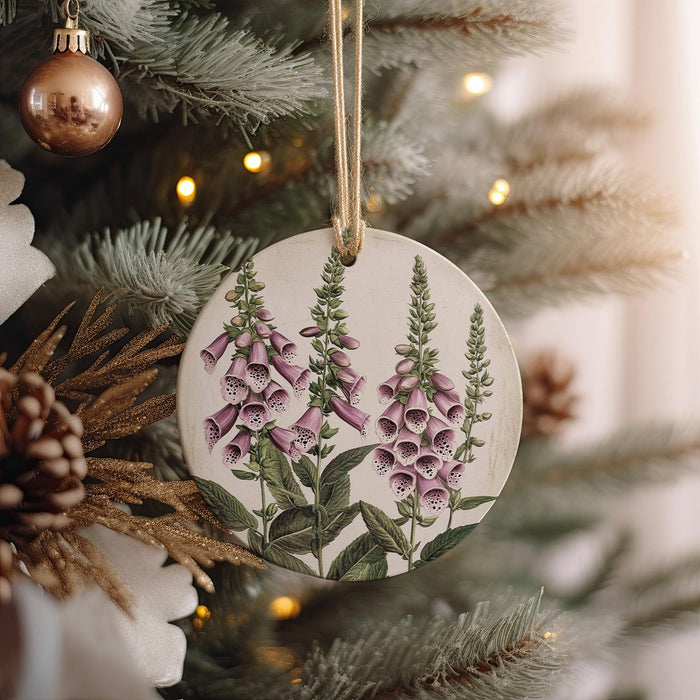 a ceramic ornament hanging from a christmas tree