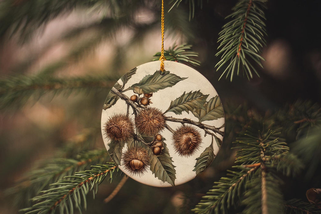 a ceramic ornament hanging from a pine tree