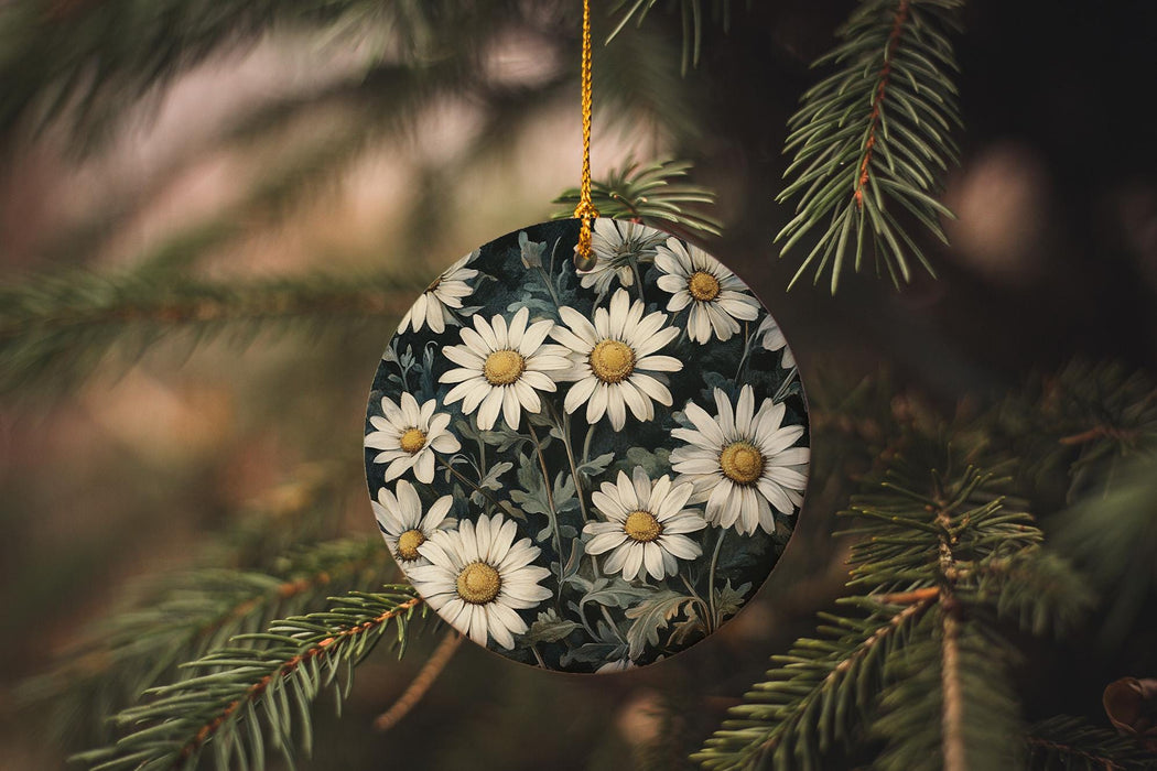 a christmas ornament hanging from a pine tree