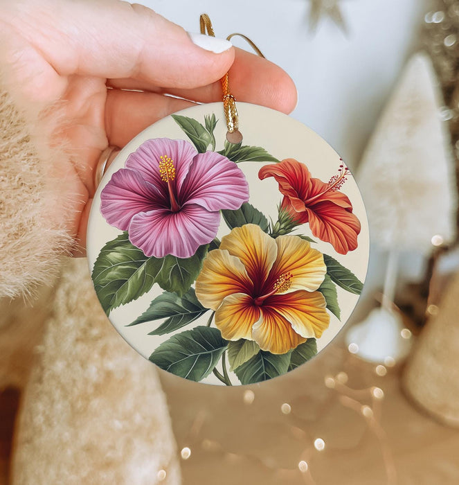 a person holding a flower ornament in their hand