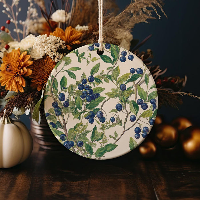 a plate with blue berries on it sitting on a table