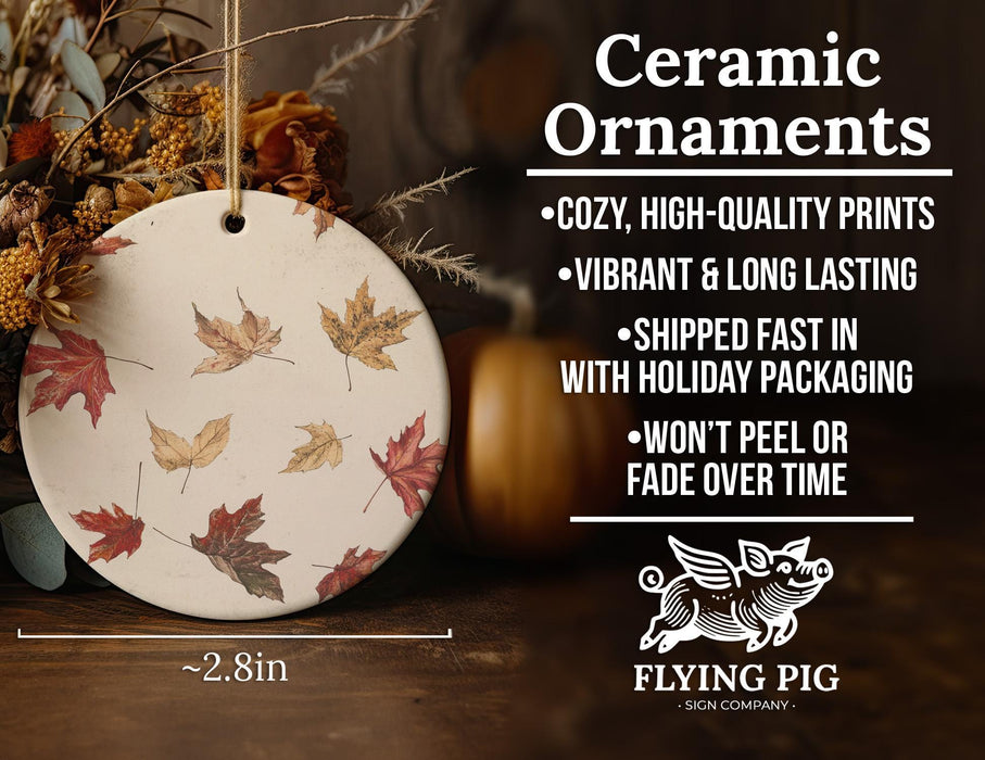 a ceramic ornament with autumn leaves on it