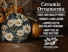 a picture of a ceramic ornament with daisies on it