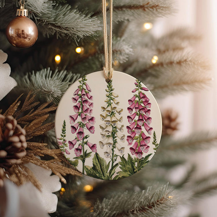 a ceramic ornament hanging from a christmas tree