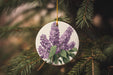 a ceramic ornament with a purple flower on it