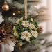 a christmas ornament hanging from a christmas tree