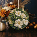a table topped with a vase filled with flowers