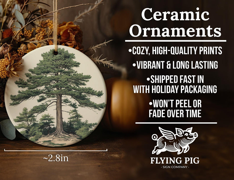 a ceramic ornament with a picture of a tree