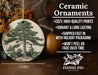 a ceramic ornament with a picture of a tree