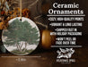 a ceramic ornament with a tree on it
