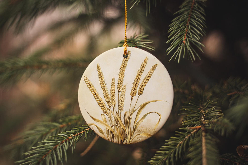 a ceramic ornament hanging from a pine tree