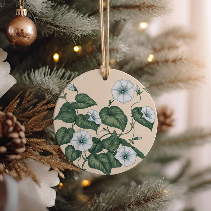 a ceramic ornament hanging from a christmas tree